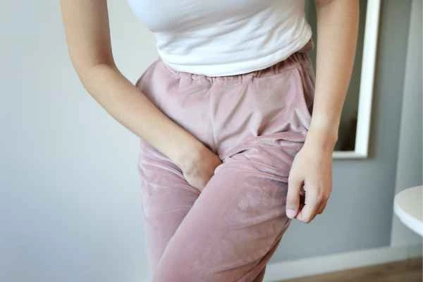 woman running for the toilet because of urinary incontinence Rugby